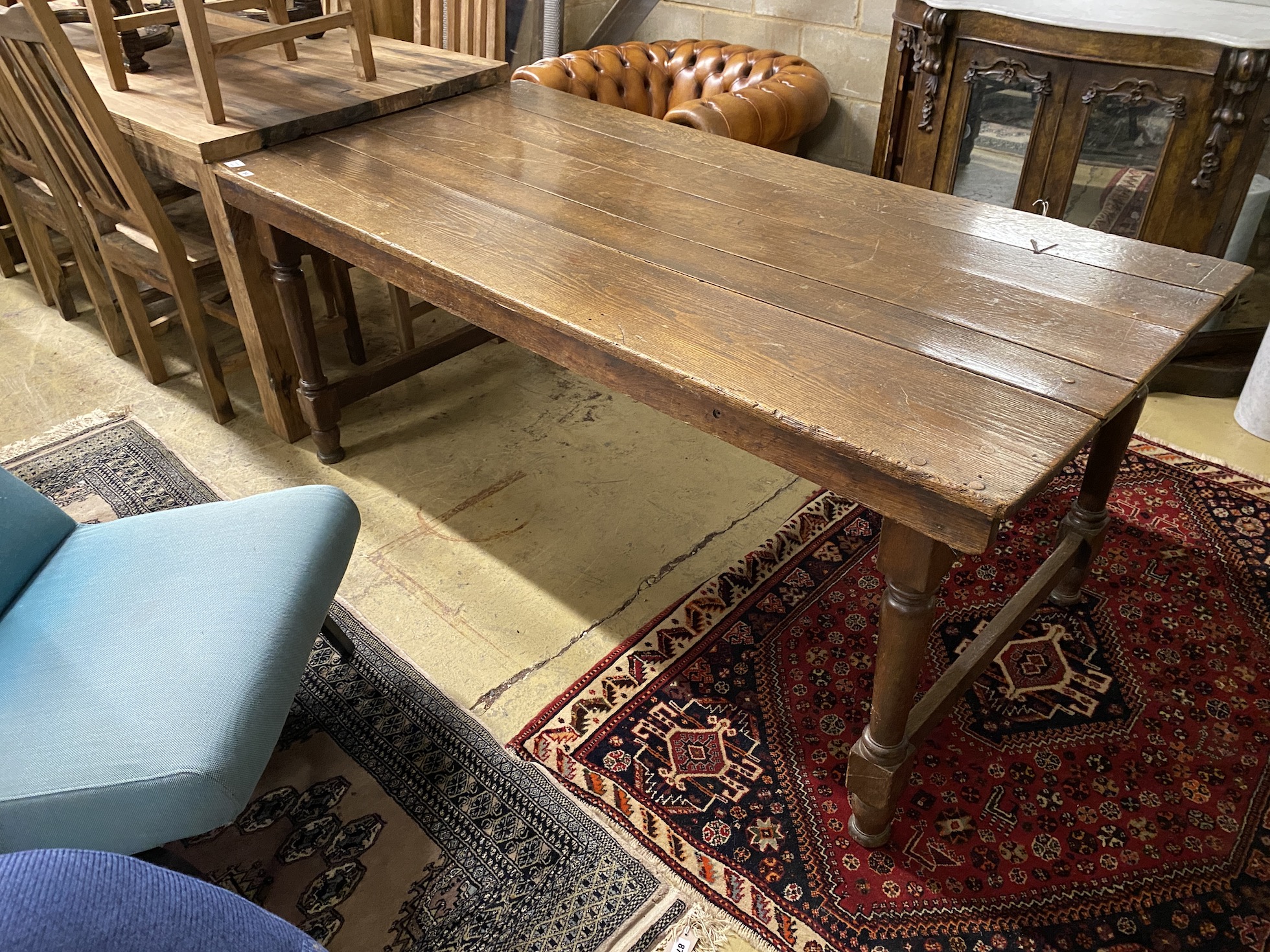 A rectangular oak refectory dining table, length 183cm, depth 87cm, height 76cm